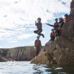 school group jumping of the seaside area