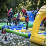 school trip group in a lake playing