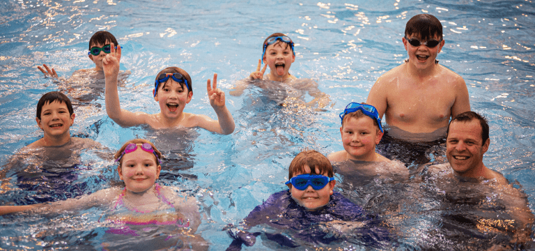 school group in swimming pool