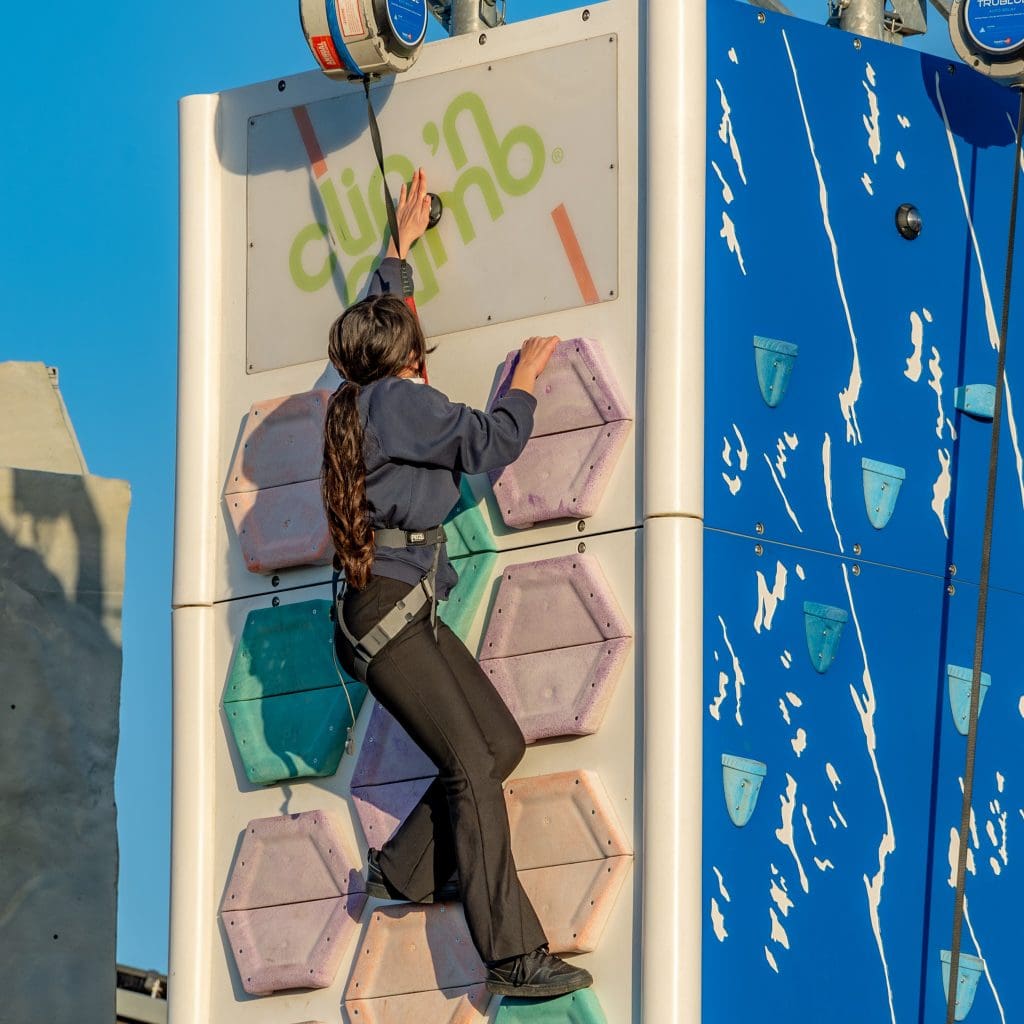 school pupil at ferry meadows activity centre on a climbing wall