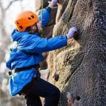 school pupil rock climbing