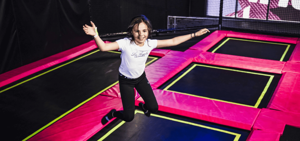 student jumping on a trampoline