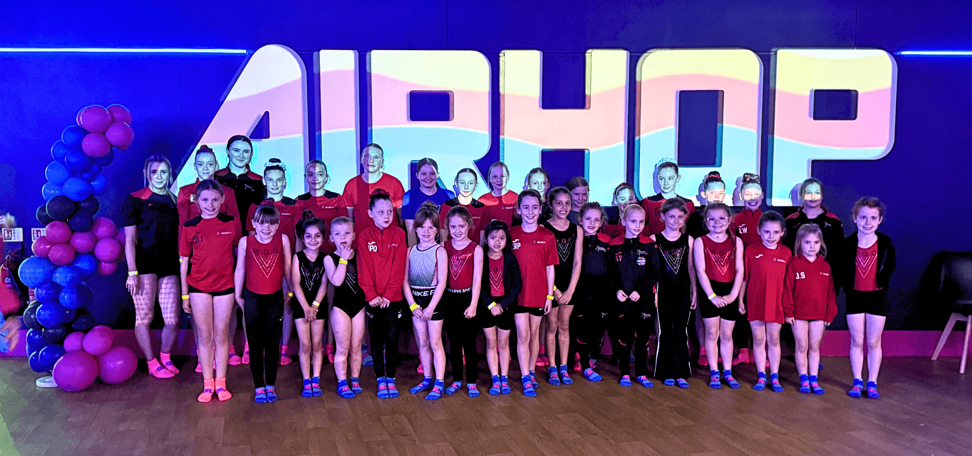 school group having a group picture taken and smiling