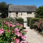 1620s outdoor house surrounded by flowers and trees