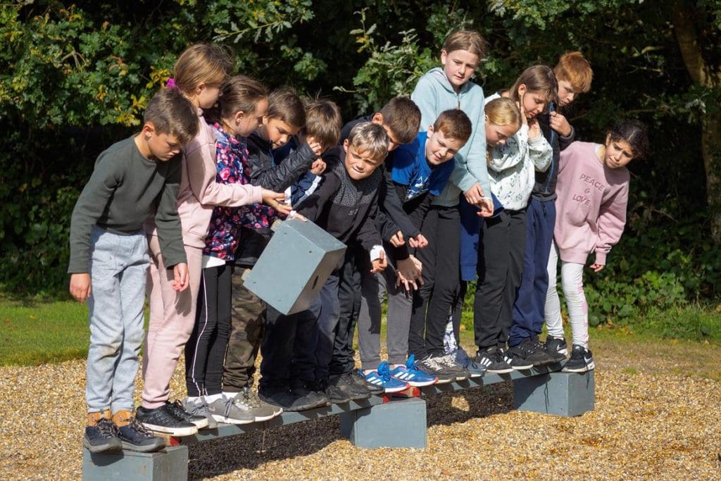 school group in a line working on a school challenge