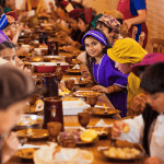 School children taking part in a medieval banquet