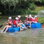 image of water rafts and student group in lake at Adventure 4 You Outdoor Activity Centre Northamptonshire