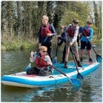 Horstead Activity Centre school trip pupils doing paddle boarding