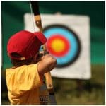 Horstead Activity Centre Image of school trip pupil doing archery