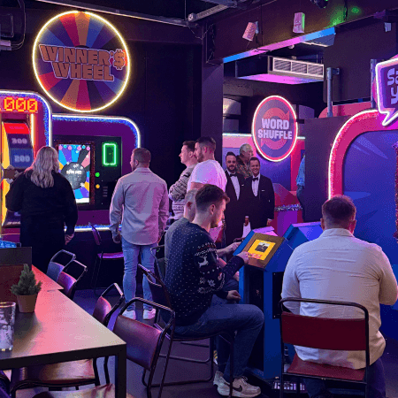 Group of students at gameshow all stars Leeds on arcades