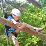 pupil climbing up log tower