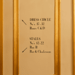 stage seating instructions on a wall at the theatre