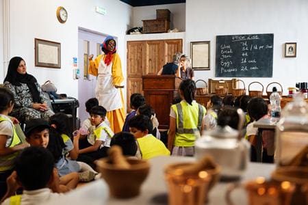 instructor at Thackray museum of medicine museum doing a presentation to a class of pupils