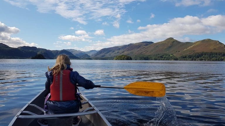 school pupil canoeing on a lake in Keswick