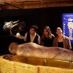 school pupils looking an a life size exhibition mummy