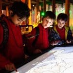 school pupils interacting with 3D map
