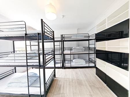 indoor group accommodation room with bunkbeds and lockers