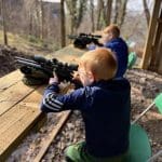 school pupil shooting a pellet pistol on a gun range