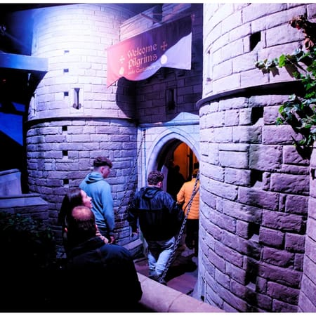 school group at indoor immersive middle ages scenery set