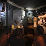 interactive museum room with face on a wall