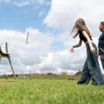 pupils outside in a field doing axe throwing
