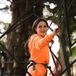 school pupil on high ropes course