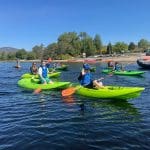 group of school pupils on kayaks