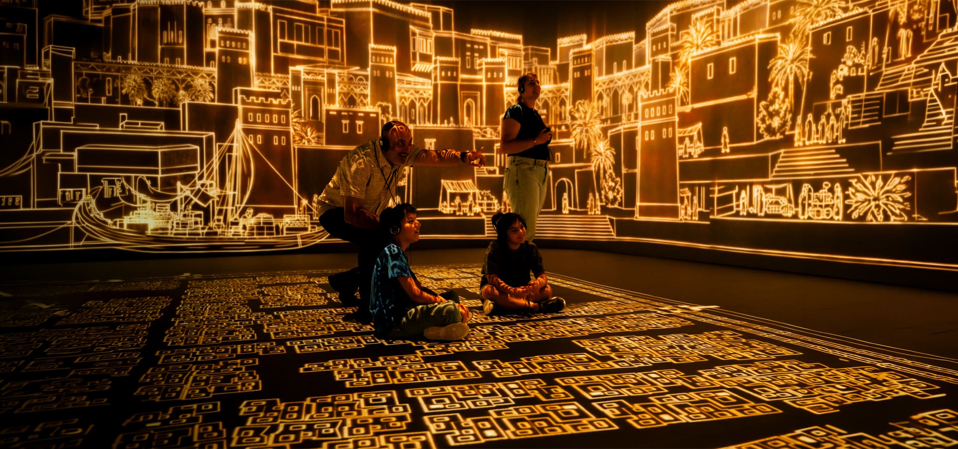 group of students inside an immersive space looking at digital history