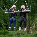 secondary pupils on hang swing in the forest