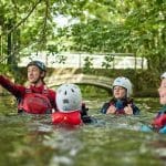school pupils in a river