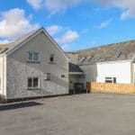 front view of Glyntawe residential building entrance and car park
